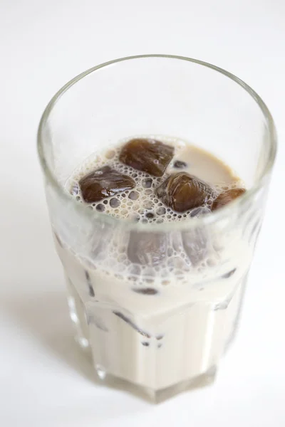 coffee ice in glass. Iced coffee cocktail or frappe with ice cubes and cream