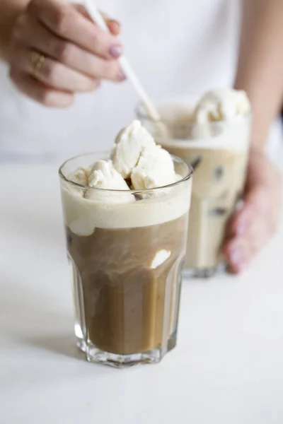 coffee ice in glass. Iced coffee cocktail or frappe with ice cubes and cream