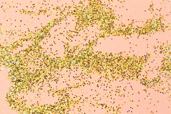 Gold Glitter Texture.gold glitter on pink background.