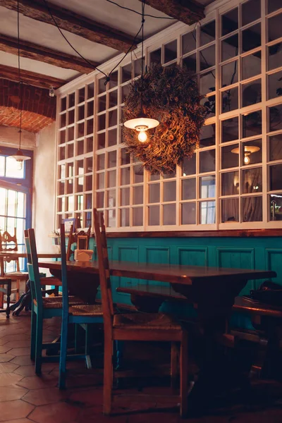 Interior of loft bar. Vintage design of cafe. Retro style restautant with vintage furniture