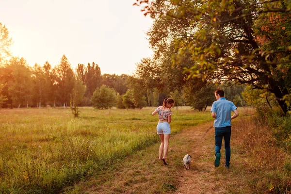 Young Couple Walking Pug Dog Autumn Forest Happy Puppy Running — Stock Photo, Image