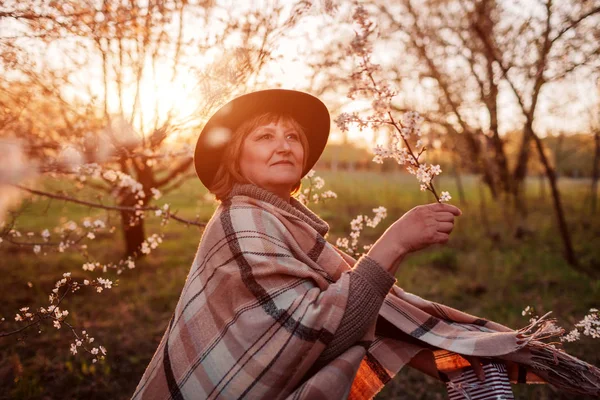 Happy woman relaxing in spring garden. Woman walking and dancing. Mother's day concept — Stock Photo, Image