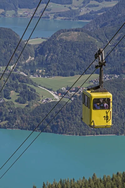 The hike or cable car ride to the 1522 m high Zwoelferhorn gives us a wonderful view of Sankt Gilgen and lakes Wolfgangsee and Mondsee in the Salzkammergut.