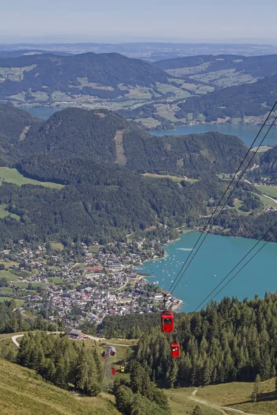 The hike or cable car ride to the 1522 m high Zwoelferhorn gives us a wonderful view of Sankt Gilgen and lakes Wolfgangsee and Mondsee in the Salzkammergut.