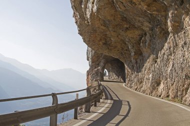 The mountain road between Vezzano and Ranzo north of Sarche was boldly created by an exposed rock face clipart