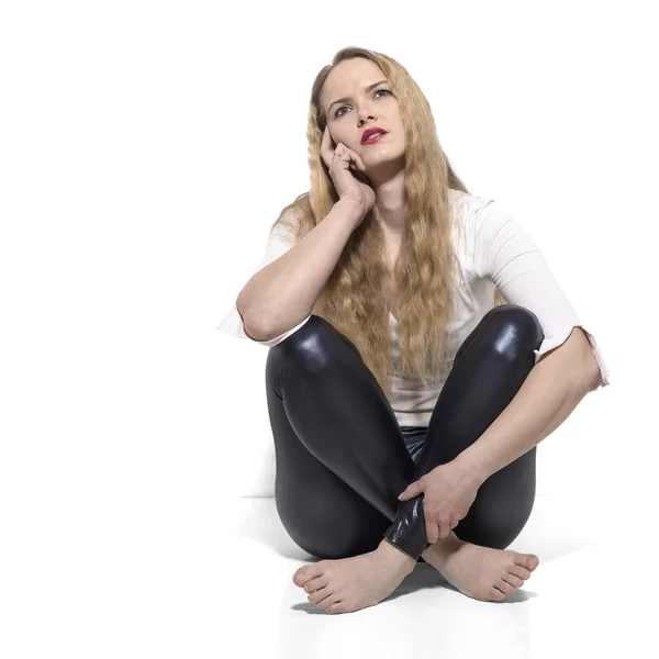Young thoughtful woman cross-legged — Stock Photo, Image