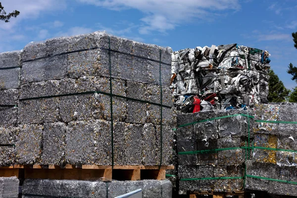 aluminum scrap and profiles pressed into cubes for remelting in a foundry