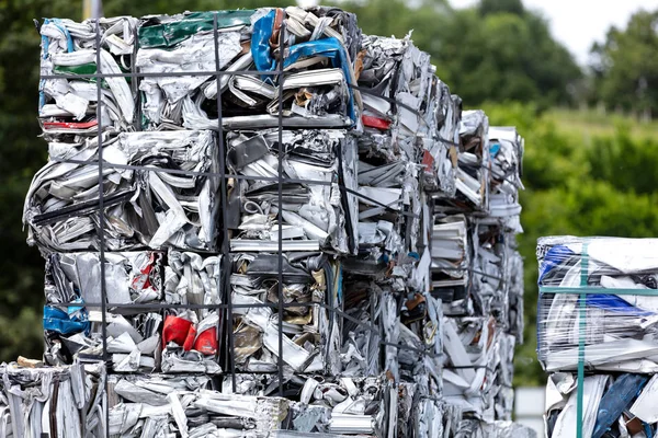 aluminum scrap and profiles pressed into cubes for remelting in a foundry