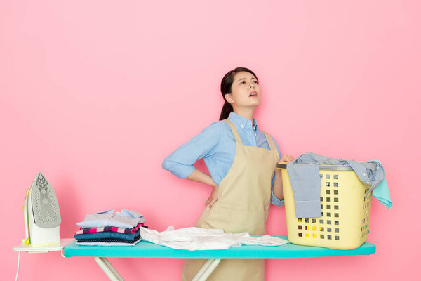 beautiful housewife feeling painful after too much housework and ironing.