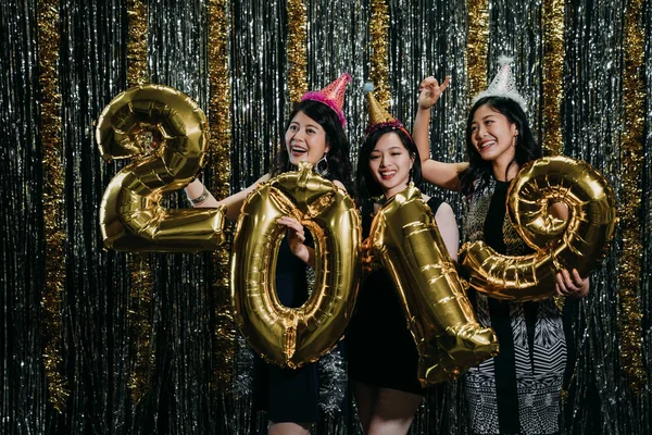 Happy new year 2019 party at nightclub. beautiful attractive pretty glamorous gorgeous magnificent charming glad ecstatic ladies chill out at fashionable club. girls celebrating enjoy music at night.