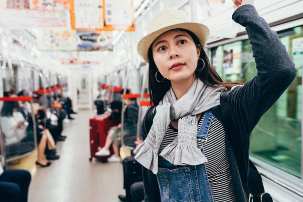 Young Girl Straw Hat Standing Subway Holding Handrail People Sitting — Stock Photo, Image