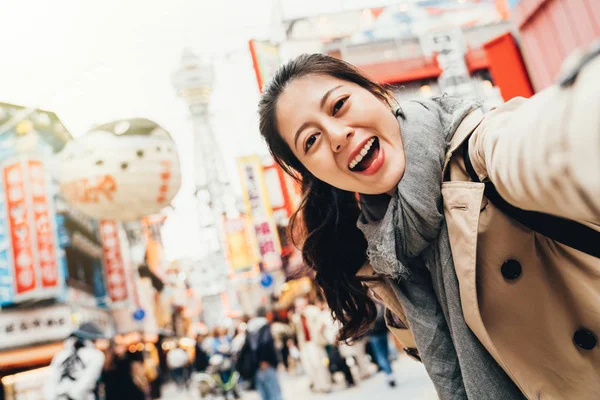 Young Female Traveler Cheerfully Taking Selfie Busy Street Tsutenkaku Osaka — Stock Photo, Image
