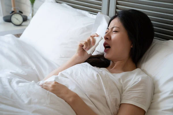 Sick asian woman sneeze with wide open mouth — Stock Photo, Image