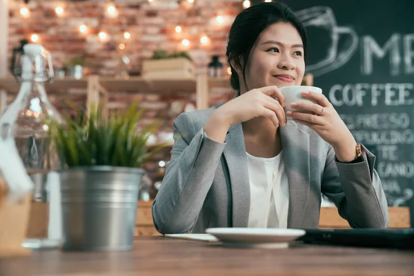 Entrepreneur asian woman looks on side thoughtful — Stock Photo, Image