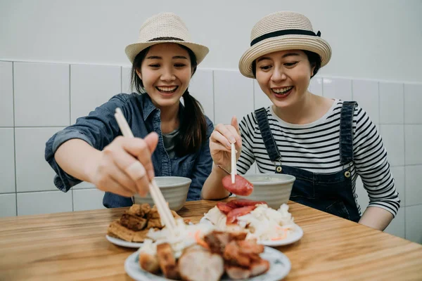 Women cheerful using chopsticks ready to eat. — Stock Photo, Image