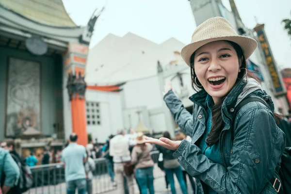 Woman smiling expression showing movie palace — Stock Photo, Image