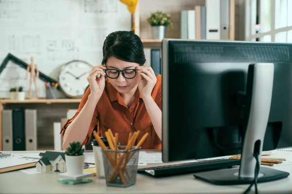 Architect taking off his glasses at office — Stock Photo, Image