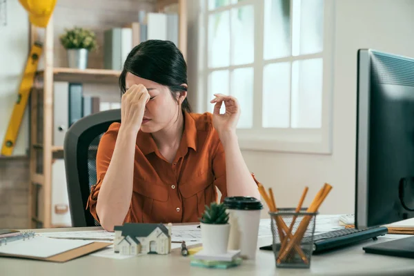 Architect massaging nose bridge having headache — Stock Photo, Image