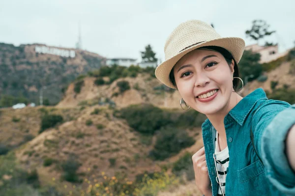 Woman in hat make self portrait outdoor nature. — Stock Photo, Image