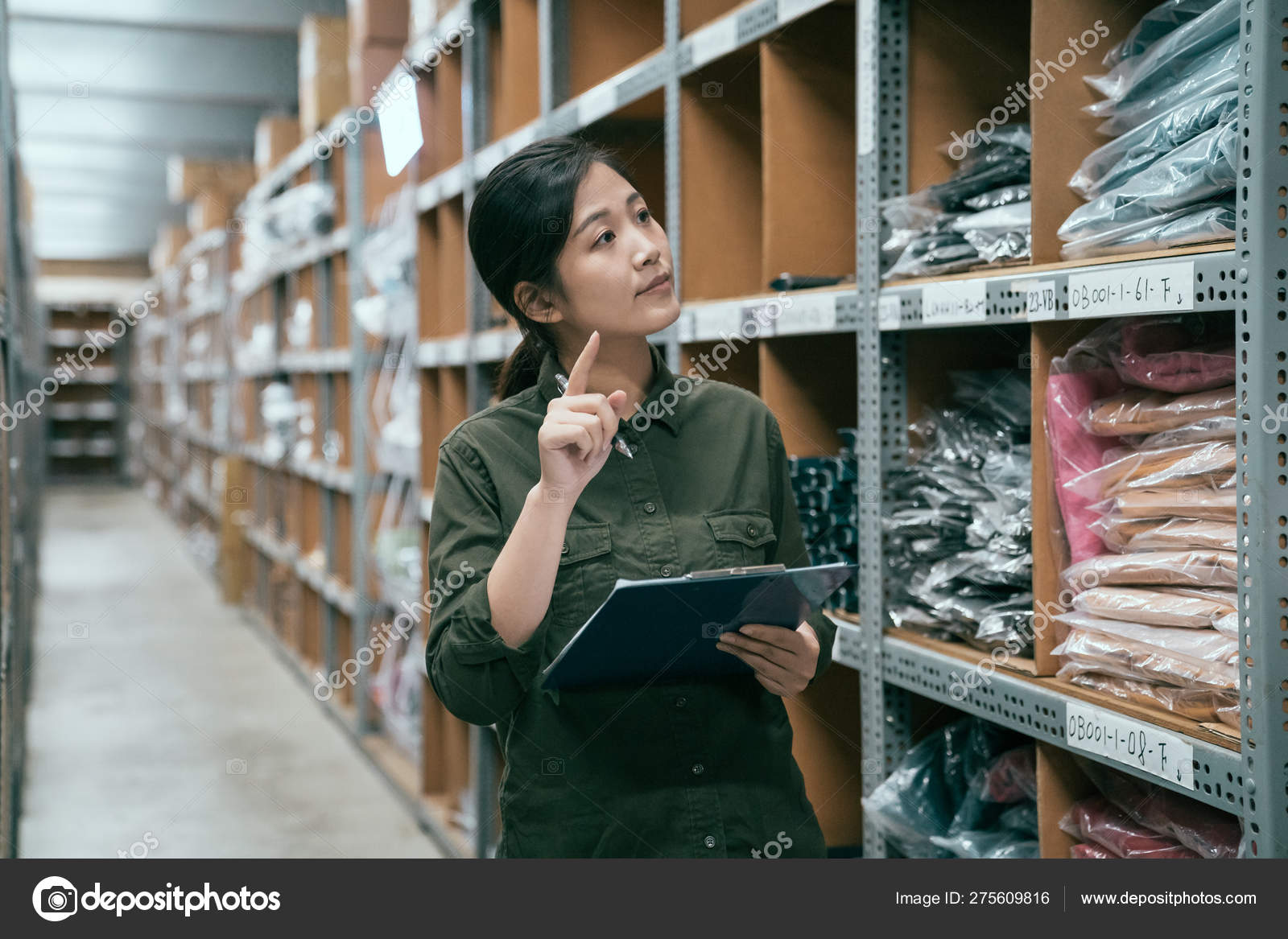 Staff stocktaking inventory in warehouse Stock Photo by