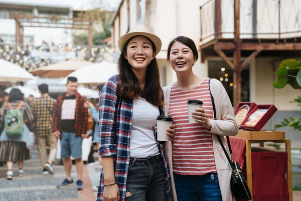 Friends standing on street in holidays event fair — Stock Photo, Image