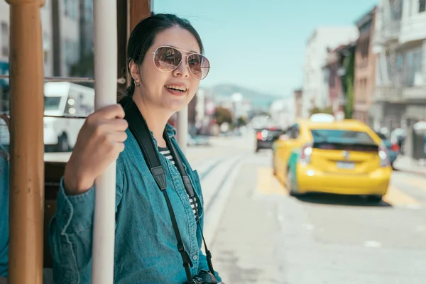 Travel girl passengers enjoy ride in cable car — Stock Photo, Image