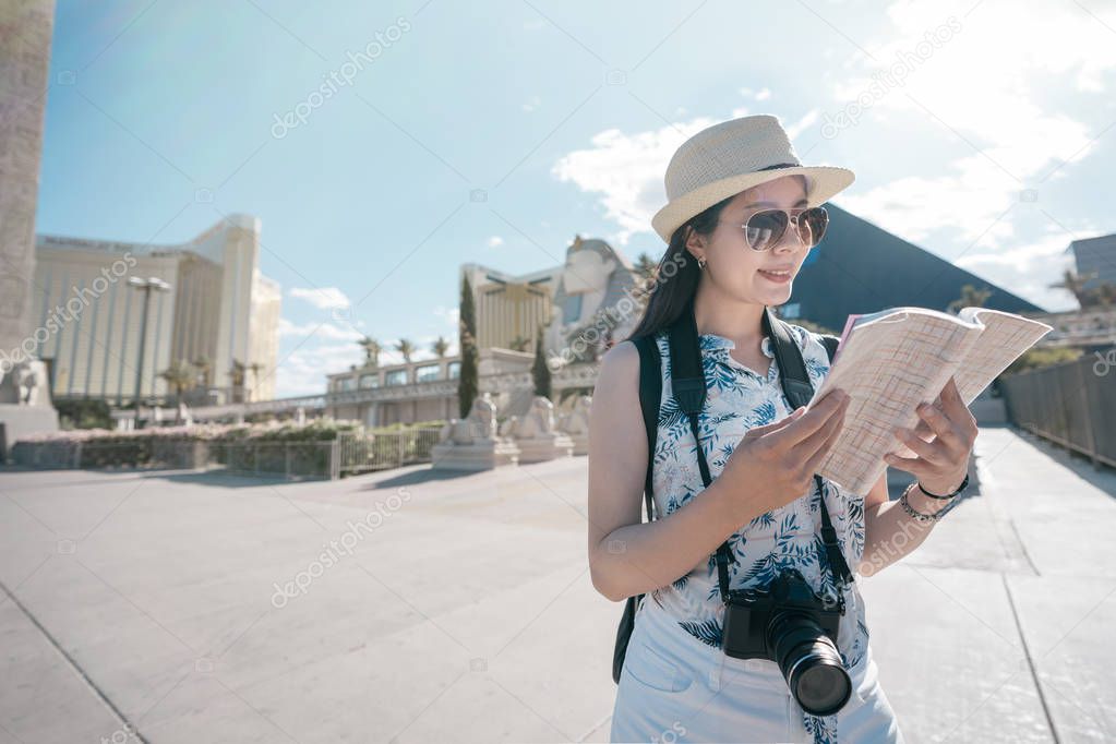 woman tourist holding guide book read information