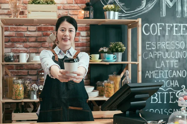 Barista in apron hold coffee cup serving — Stock Photo, Image