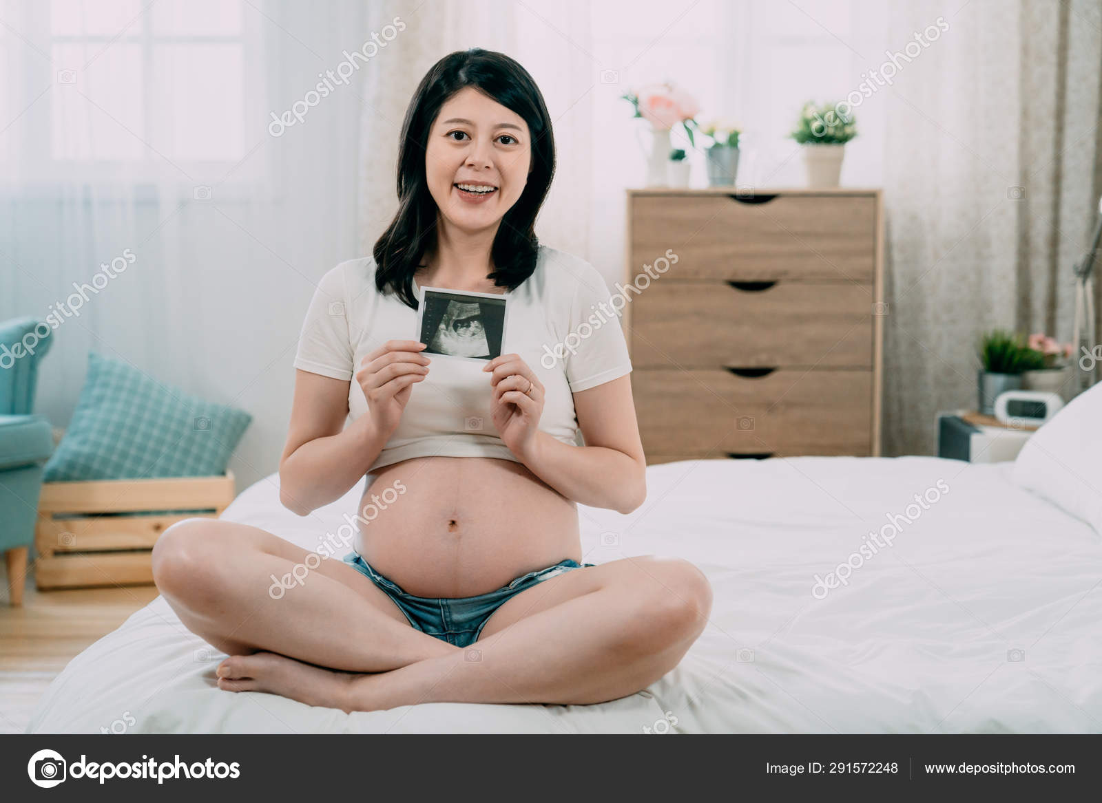 Maternity Mom Showing Ultrasound Scan Photo Stock Photo