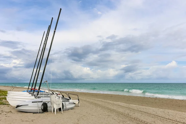 Sailing catamarans without sails on the beach, Cuba, Varadero