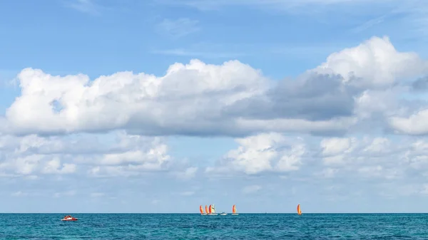 Sailboats sailing on ocean against sky, Cuba, Varadero