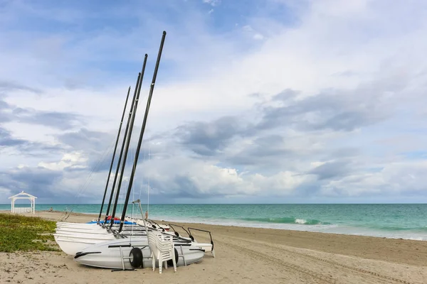 Sailing catamarans without sails on the beach, Cuba, Varadero