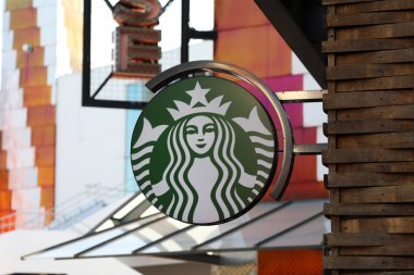 Chessy, France - October 13, 2018: Starbucks Sign Is Displayed At The Facade Of A Starbucks Store. Starbucks Corporation Is An American Coffee Company And The Largest Coffeehouse Company In The World With 28,278 Stores In 76 Countries clipart