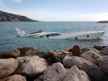 Menton, France - November 3, 2018: Close Up View Of Luxury Yacht Half Sunken After Adrian Storm In The Mediterranean Sea. Menton, France, Europe clipart
