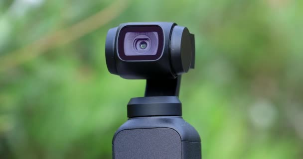 Closeup Small Gimbal Camera Head Automatically Tracks Subject Green Nature — Stock Video