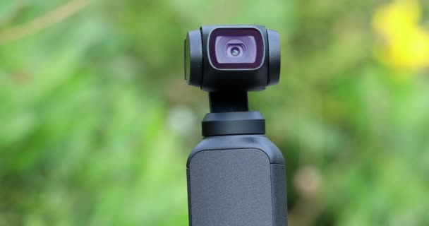 Closeup Small Gimbal Camera Head Automatically Tracks Subject Green Nature — Stock Video