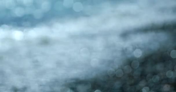五颜六色的抽象散景白海水圈在海滩卵石 抽象背景 Dci 分辨率 — 图库视频影像