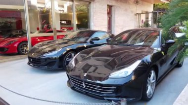 Monte-Carlo, Monaco - September 20, 2019: Two Luxury Ferrari Supercars Parked In Front Of The Scuderia Monte-Carlo, Ferrari Official Car Dealer, 5 Avenue Princesse Grace In Monaco On The French Riviera, Europe - 4K Video