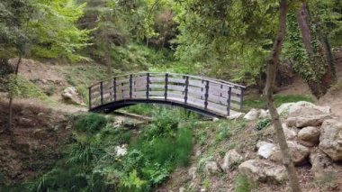 Beautiful Small Wooden Bridge Over Pond In Nature In The Mountain On The French Riviera In France - 4K Video