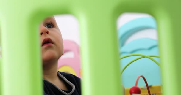 Cute Baby Boy Watching His Colorful Playpen Close Portrait View — Stock Video