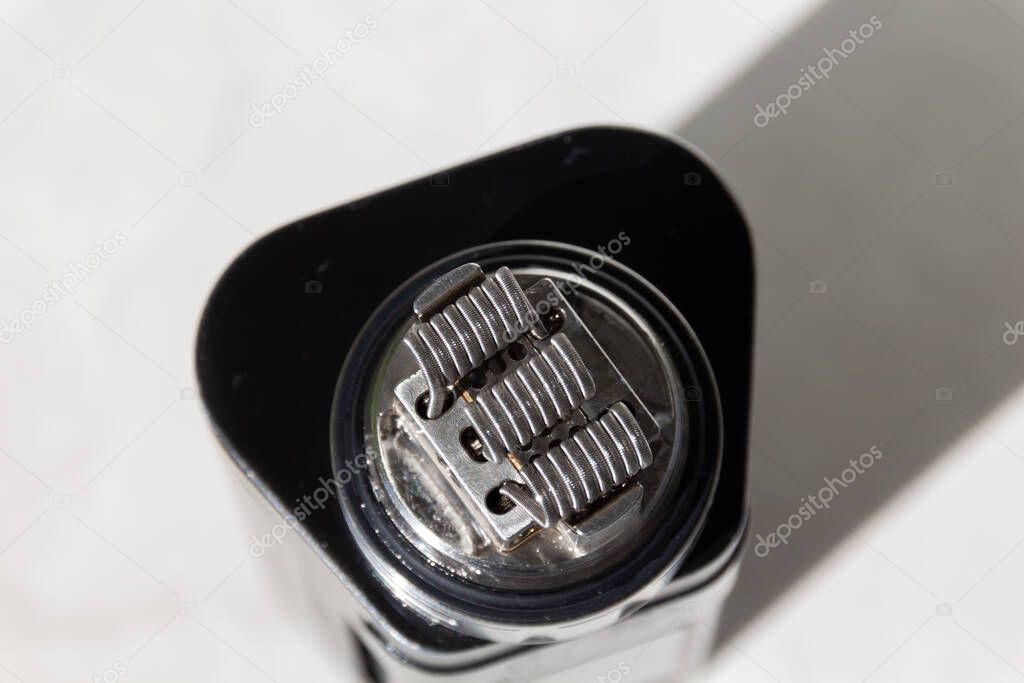 Three fused coils on vaping rebuildable atomizer.