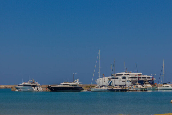 Rethymno, Greece - August  1, 2016: Yachts in the Rethymno Harbour. Rethymno is the 3rd largest city of the island. Crete attracts 2.8 million annual tourists (2011).