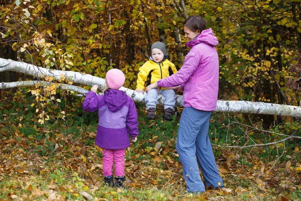 Mother with children together in nature on a nice autumn day. — Stock Photo, Image