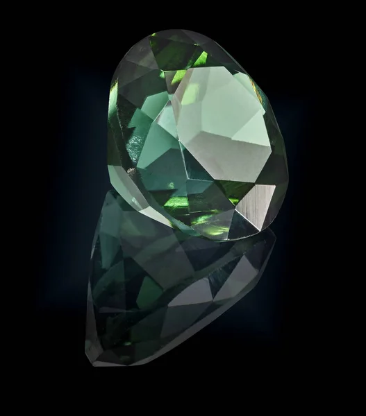 tourmaline gem stone isolated on black background.