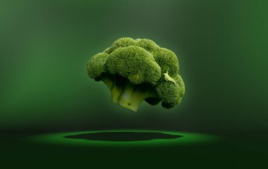 Brokoli yeşil bir arka zemin üzerinde yüzen.