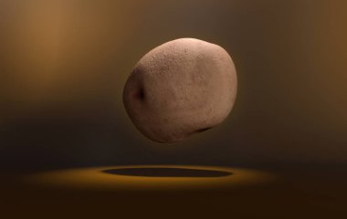 patato kahverengi bir arka zemin üzerinde yüzen.