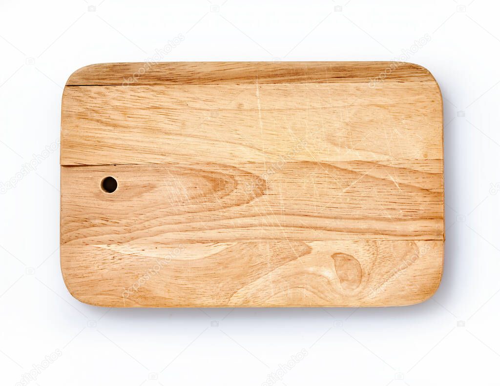  Top view of used  brown wooden cutting board on white background