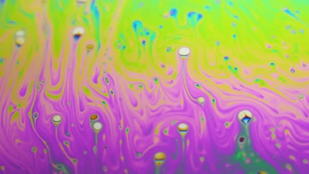 Psychedelic background of motion surface of colorful soap bubble — Stock Video