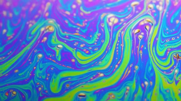 Psychedelic background of motion surface of colorful soap bubble — Stock Video