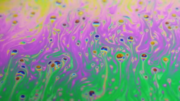 Psychedelic background of motion surface of colorful soap bubble — Stock Video